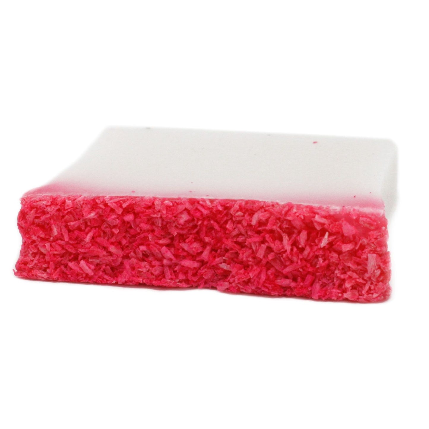A handcrafted artisan soap slice with a vibrant red base and a thick, creamy white coconut-scented top layer.