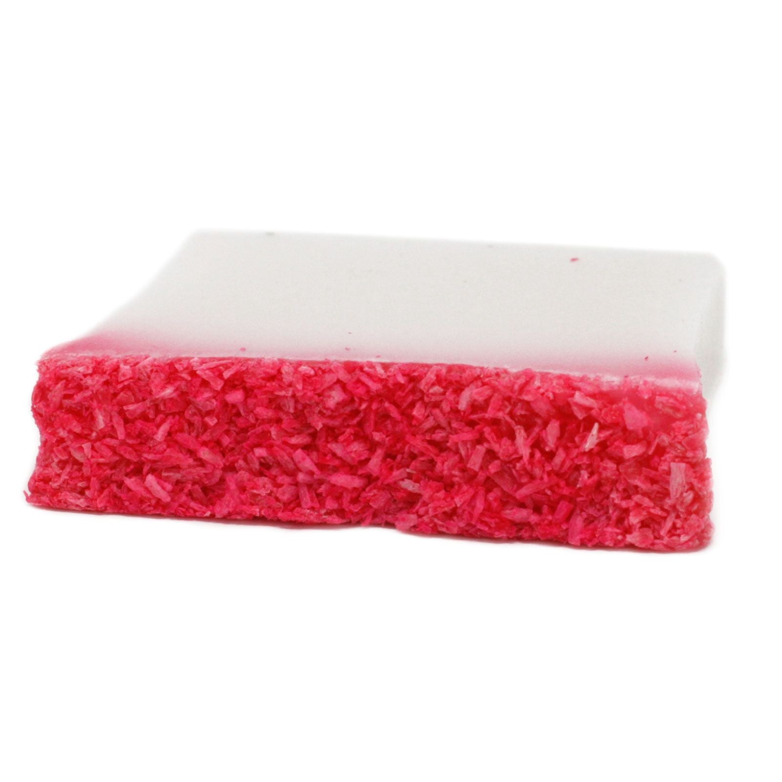 A handcrafted artisan soap slice with a vibrant red base and a thick, creamy white coconut-scented top layer.