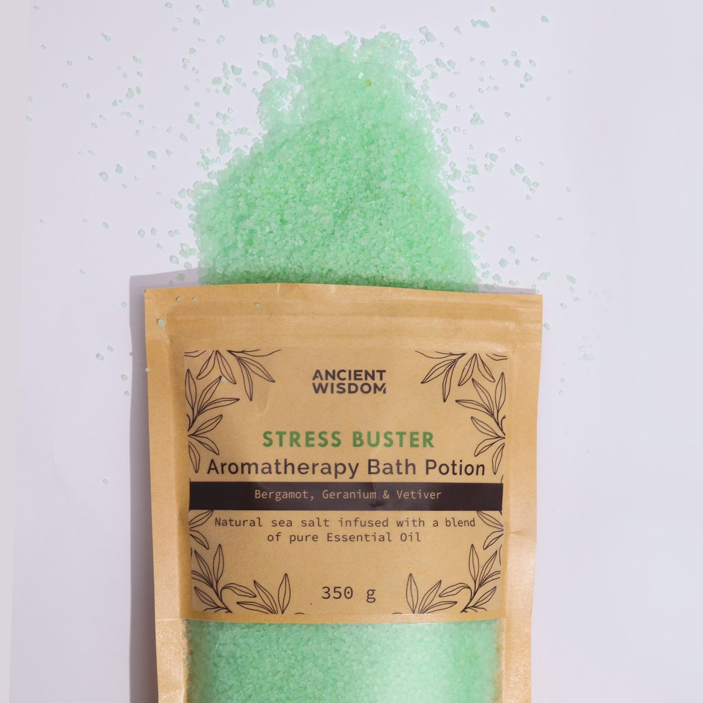 A rustic kraft paper bag filled with green-tinted aromatherapy bath salts, designed to relieve tension and stress.