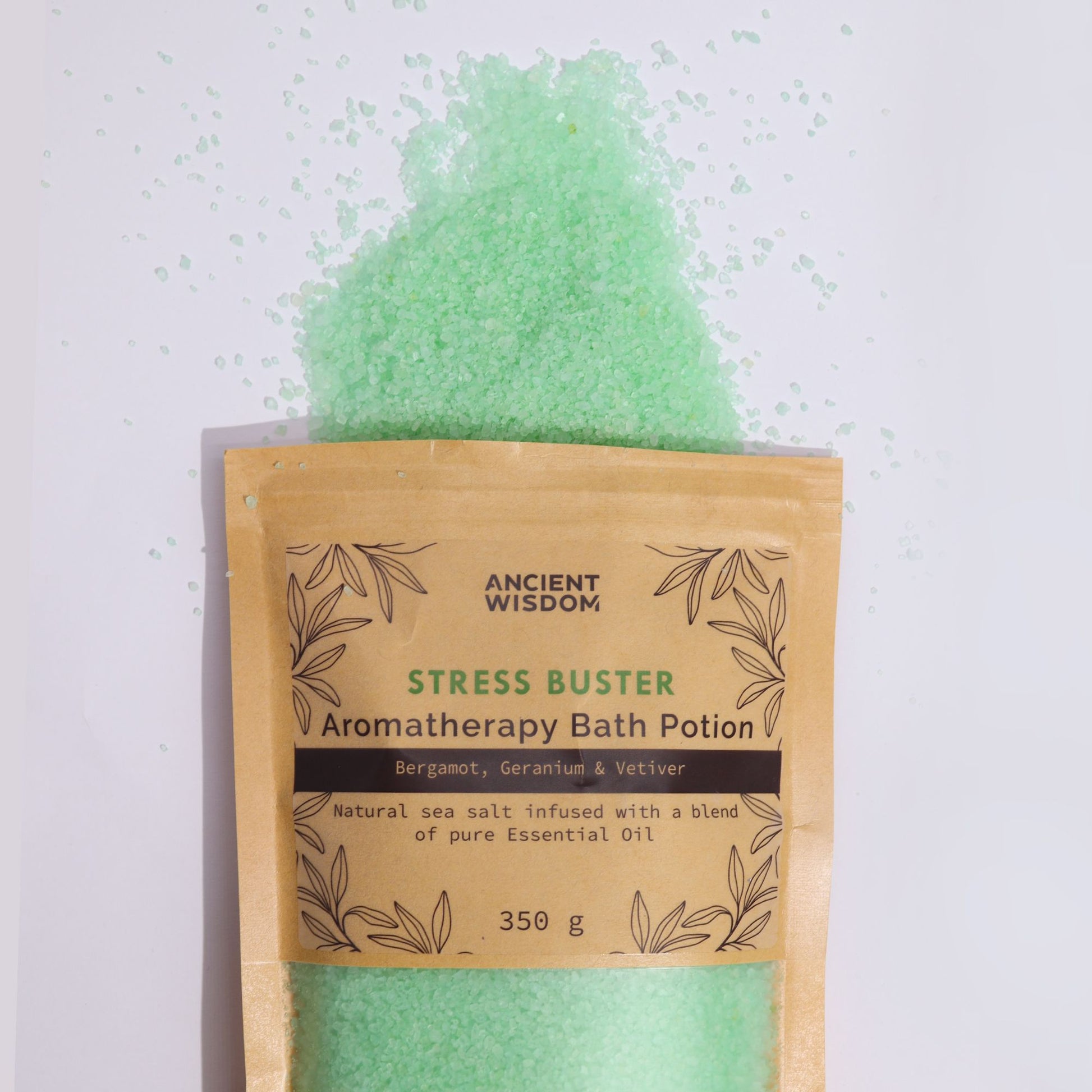 A rustic kraft paper bag filled with green-tinted aromatherapy bath salts, designed to relieve tension and stress.