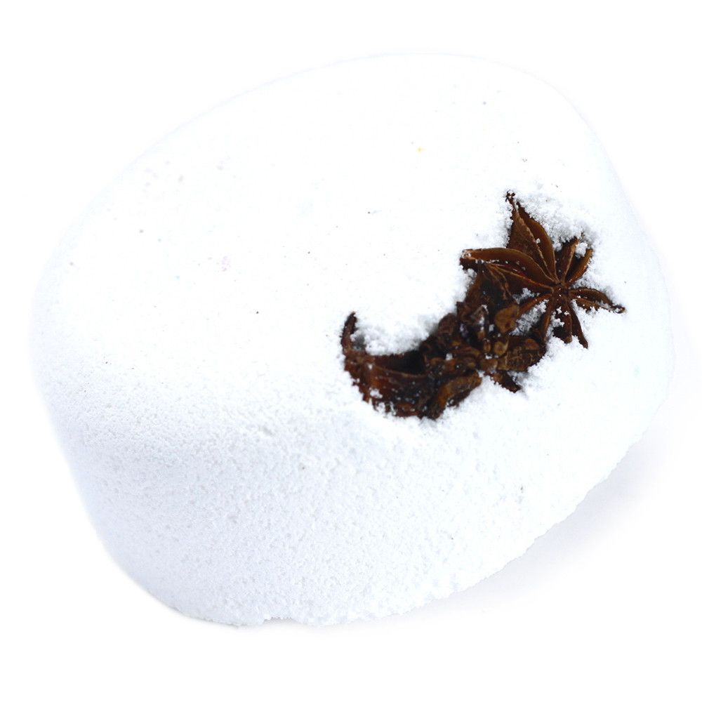 A white spherical bath bomb decorated with a dark, star-shaped botanical inclusion on top.