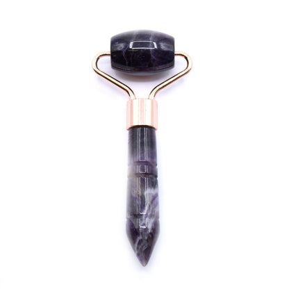 A compact, mini gemstone facial roller made from natural purple amethyst with a sleek black handle.