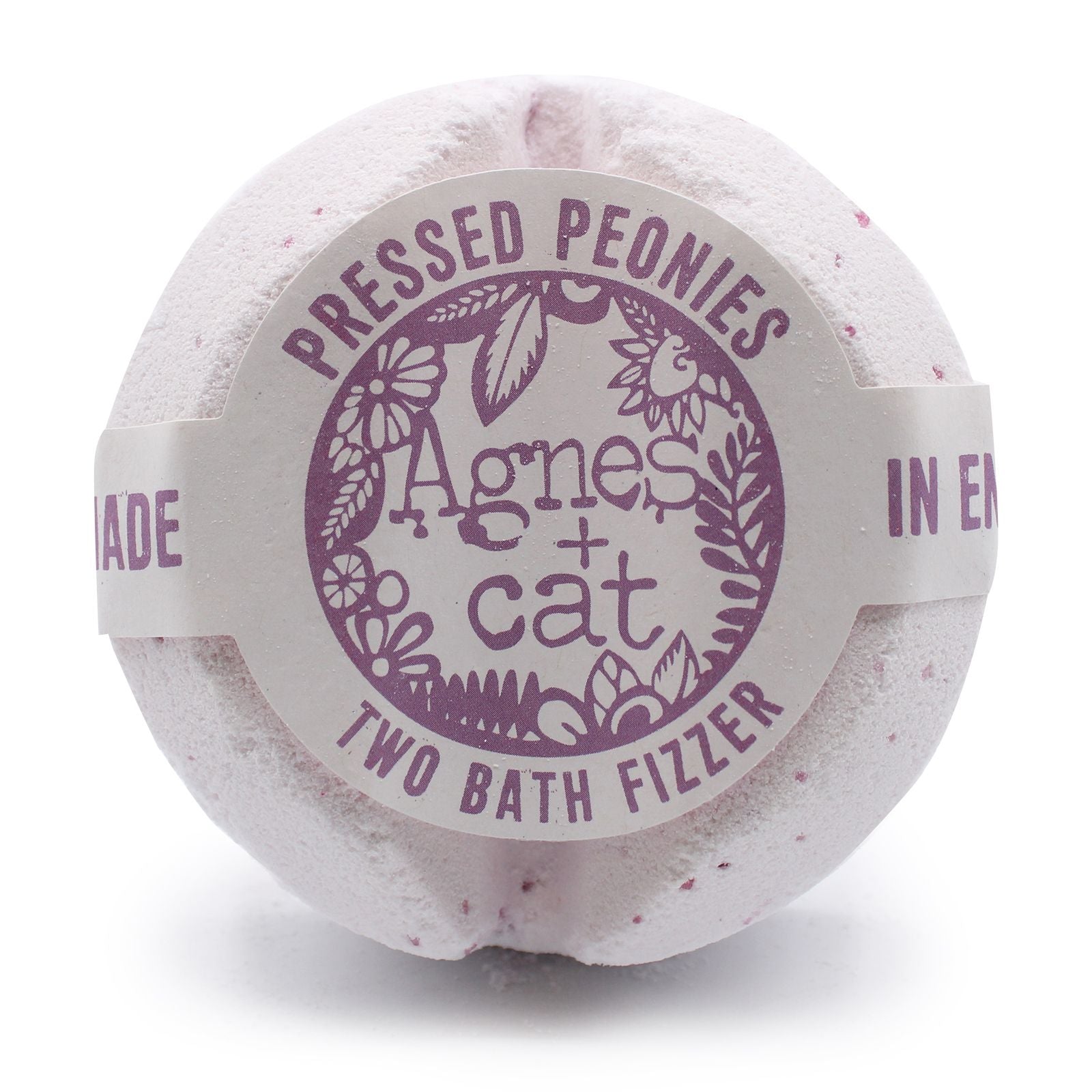 A large, round white bath fizzer wrapped in clear film with a sophisticated purple and white floral label.