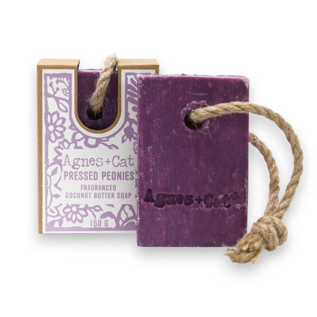 A 150g purple and cream layered soap on a rope with a delicate pressed peony fragrance, perfect for hanging in the shower.