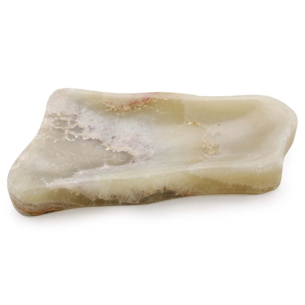 A hand-carved soap dish made from natural honey onyx featuring unique, translucent golden stone patterns.