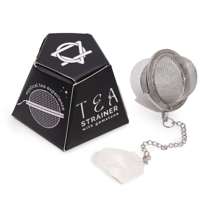 Stainless steel mesh tea infuser ball with a raw clear rock quartz gemstone charm hanging on a silver chain.