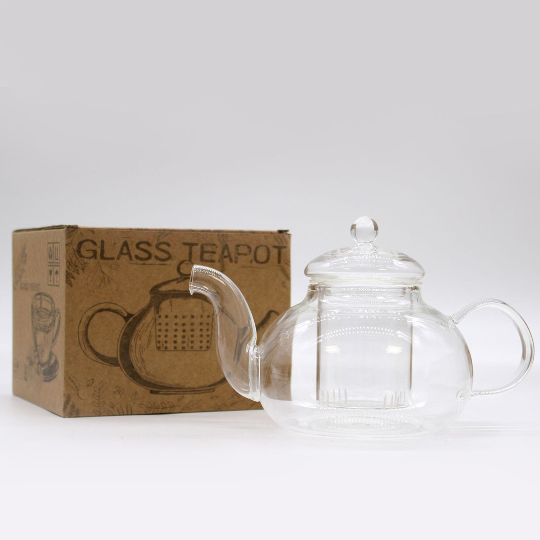 A round, transparent borosilicate glass teapot with a removable glass infuser and a clear glass lid.