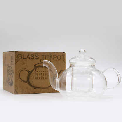 A round, transparent borosilicate glass teapot with a removable glass infuser and a clear glass lid.