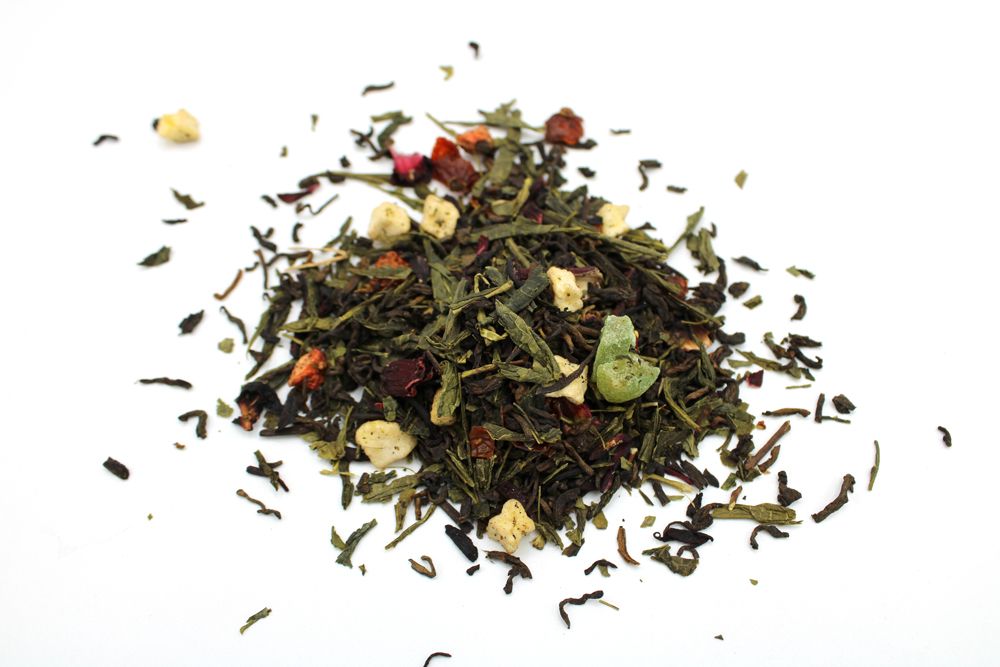A large bulk quantity of loose-leaf herbal tea featuring vibrant dried summer fruits and colorful flower petals.