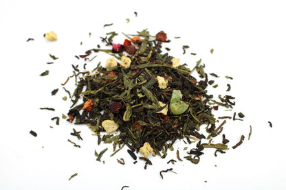 A large bulk quantity of loose-leaf herbal tea featuring vibrant dried summer fruits and colorful flower petals.