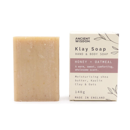 A handcrafted tan-colored clay soap bar infused with natural honey and oatmeal for sensitive skin relief.
