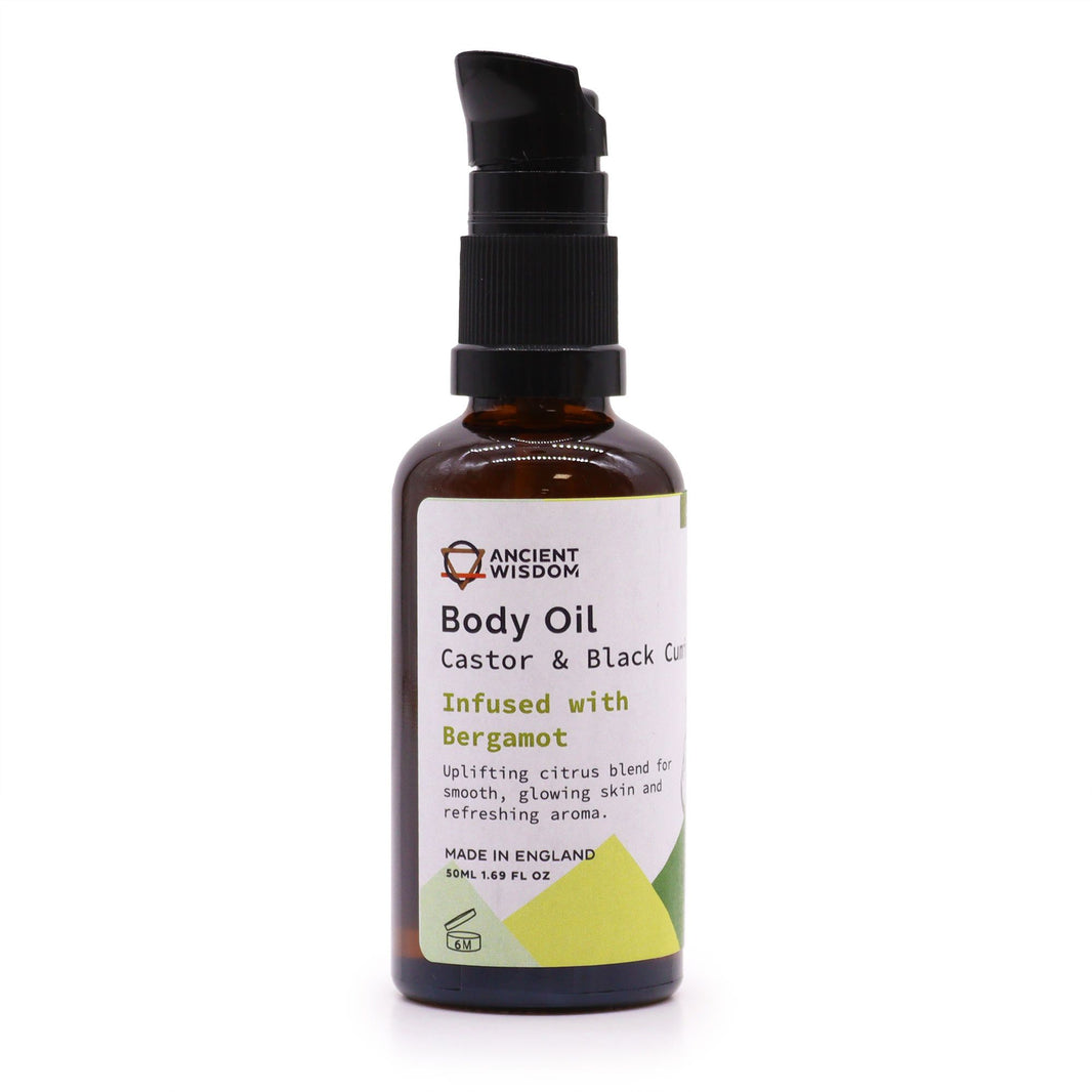 A 50ml organic bergamot body oil in an amber glass bottle with a professional black pump dispenser.