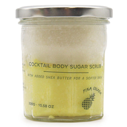 A 300g jar of creamy yellow sugar body scrub featuring a tropical pineapple and coconut fragrance.