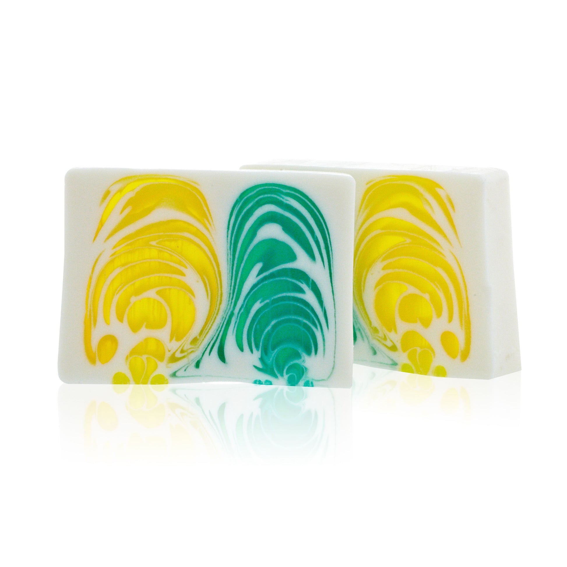 A 115g handcrafted soap slice with vibrant yellow and green swirls and a fresh citrus fruit scent.