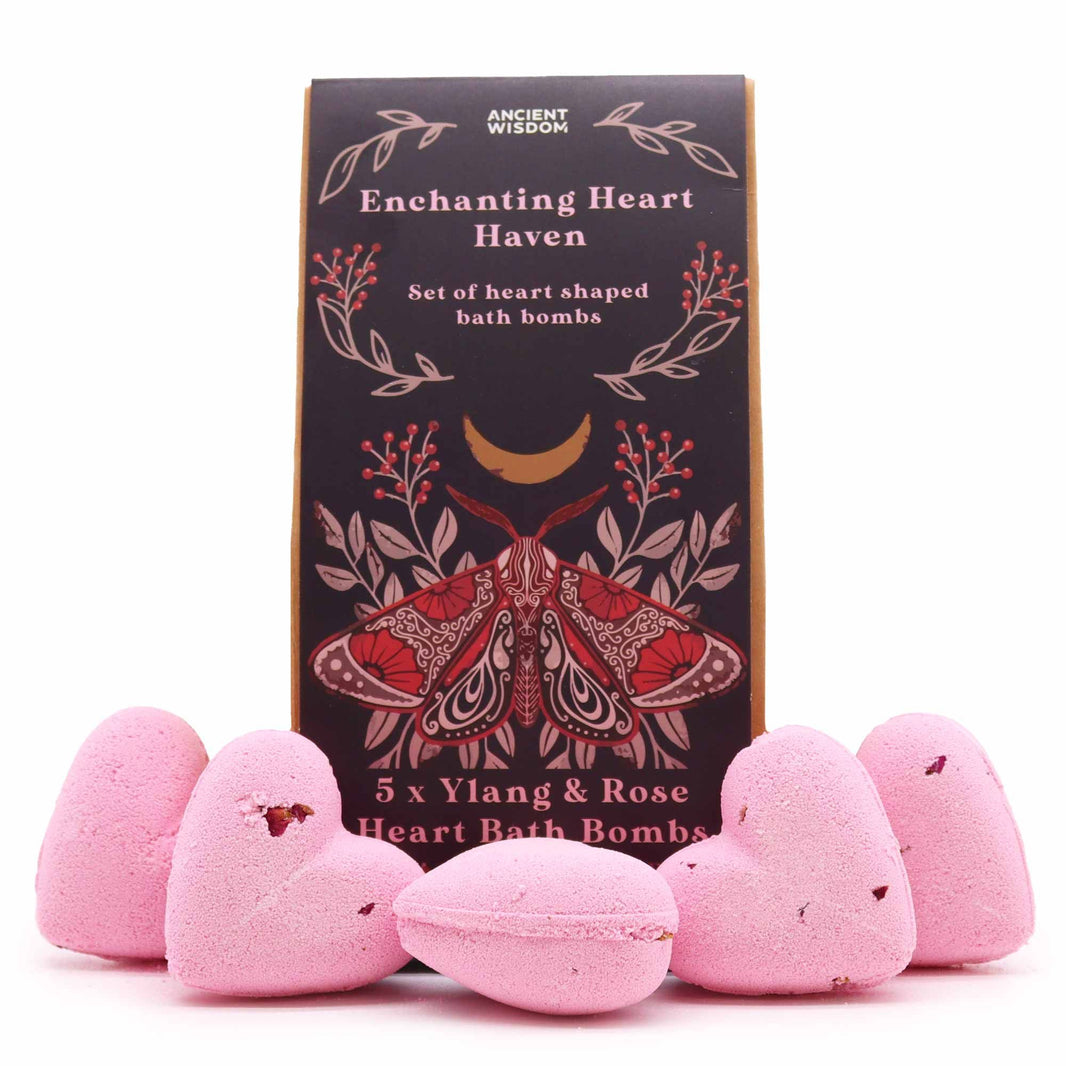 A decorative gift box containing multiple small pink heart-shaped bath treats arranged in a charming display.