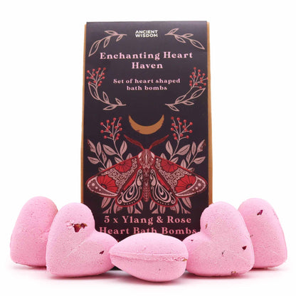 A decorative gift box containing multiple small pink heart-shaped bath treats arranged in a charming display.