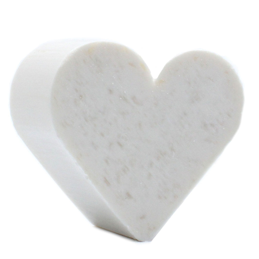 Ten small white heart-shaped guest soaps featuring a tropical coconut fragrance, perfect for hospitality.