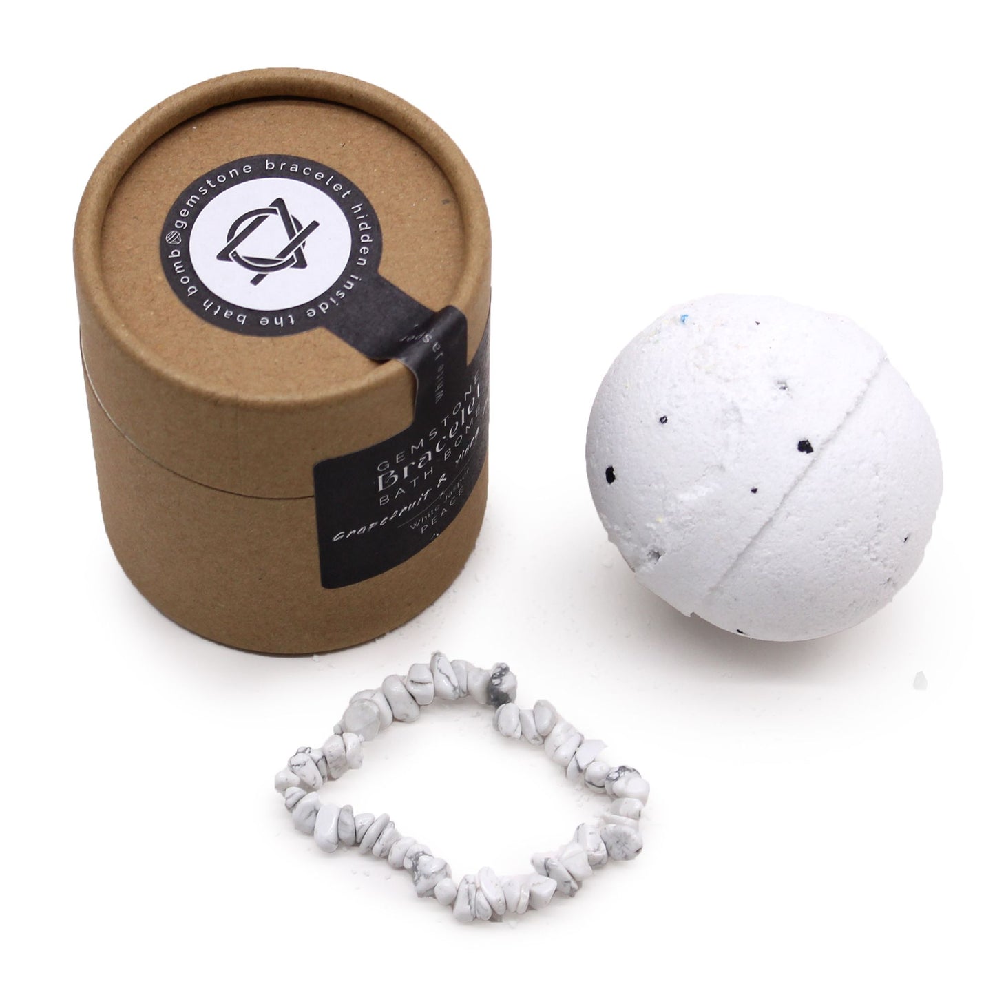 A 170g white bath bomb with a white Jasper gemstone bracelet displayed as a hidden treasure inside, perfect for spiritual gifting.