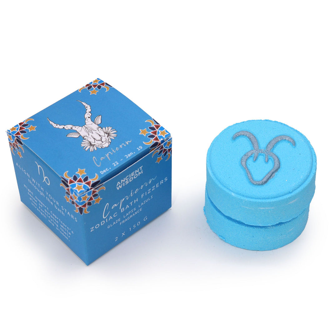 A blue-themed set of zodiac bath fizzers for the Capricorn sign, featuring the goat symbol and ritual horoscope information.