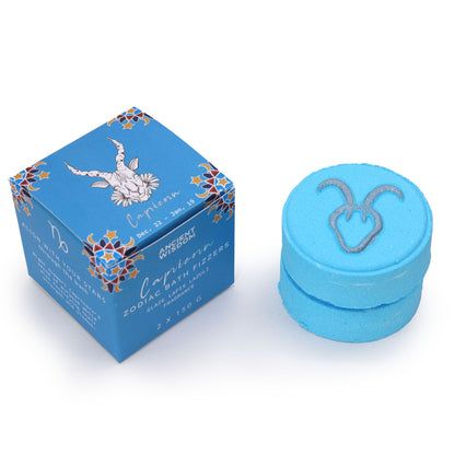 A blue-themed set of zodiac bath fizzers for the Capricorn sign, featuring the goat symbol and ritual horoscope information.
