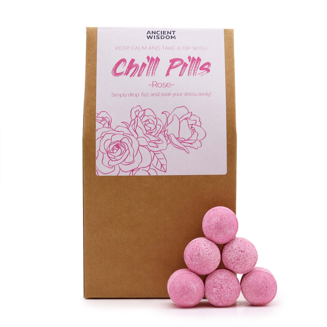A rustic gift pouch containing pink rose-scented mini bath fizzers with a professional Chill Pills brand label.
