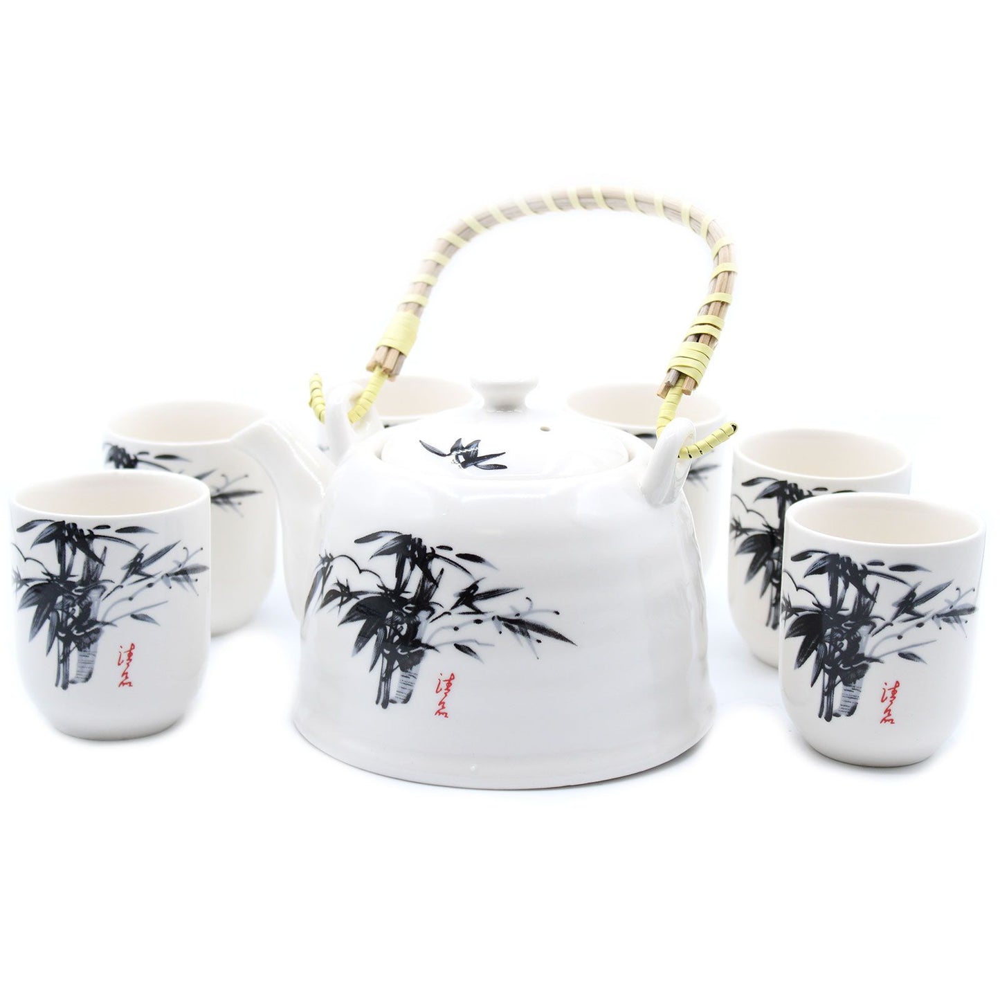 A classic white stone-textured teapot with a bamboo handle and four matching cups featuring traditional oriental floral patterns.