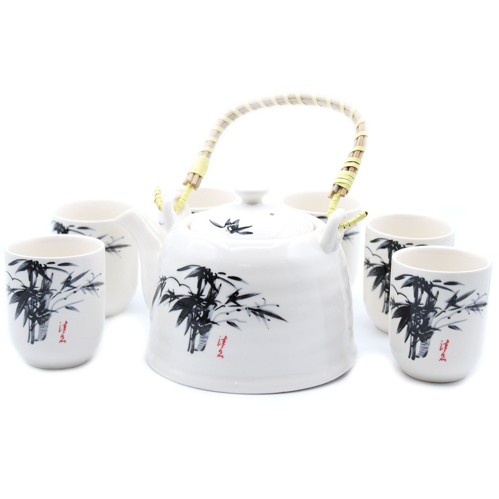 A classic white stone-textured teapot with a bamboo handle and four matching cups featuring traditional oriental floral patterns.