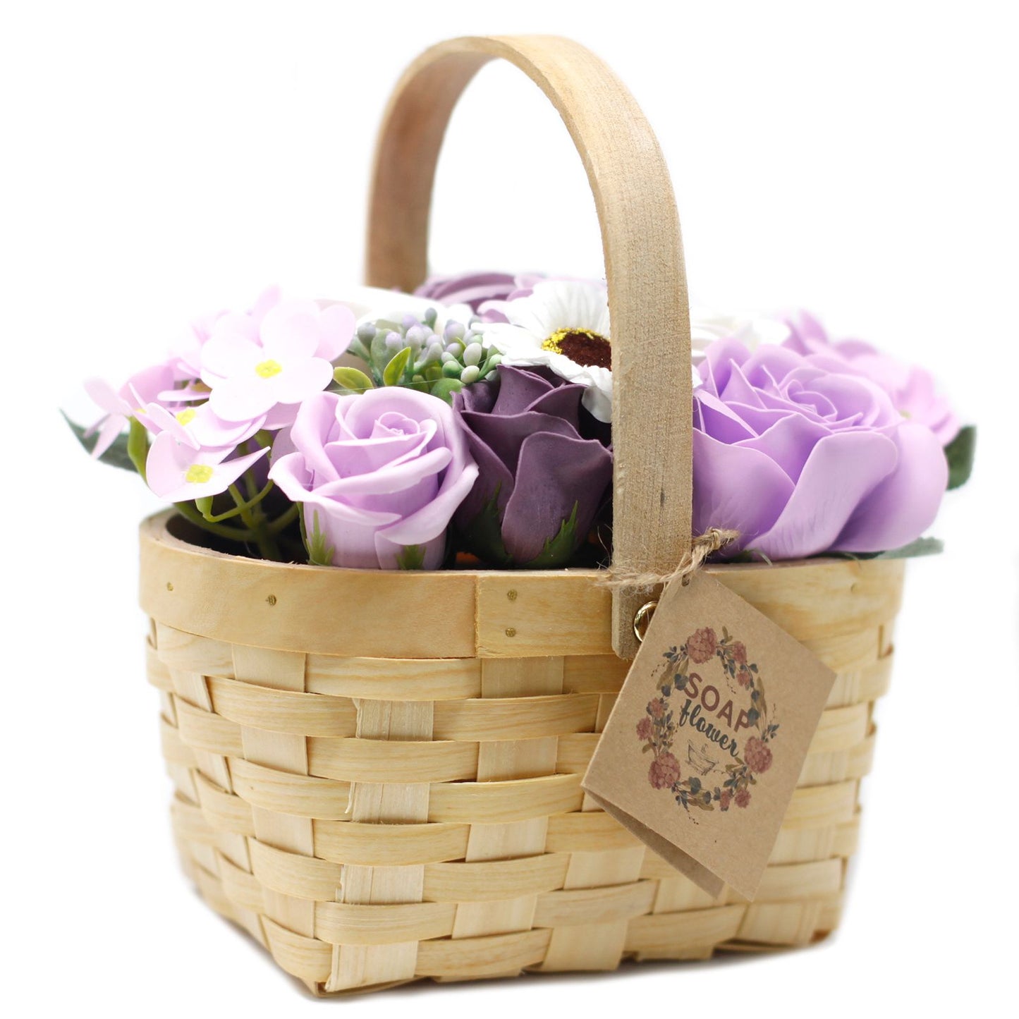 A large, decorative wicker gift basket packed with an abundant arrangement of realistic lilac soap roses and purple floral blooms.