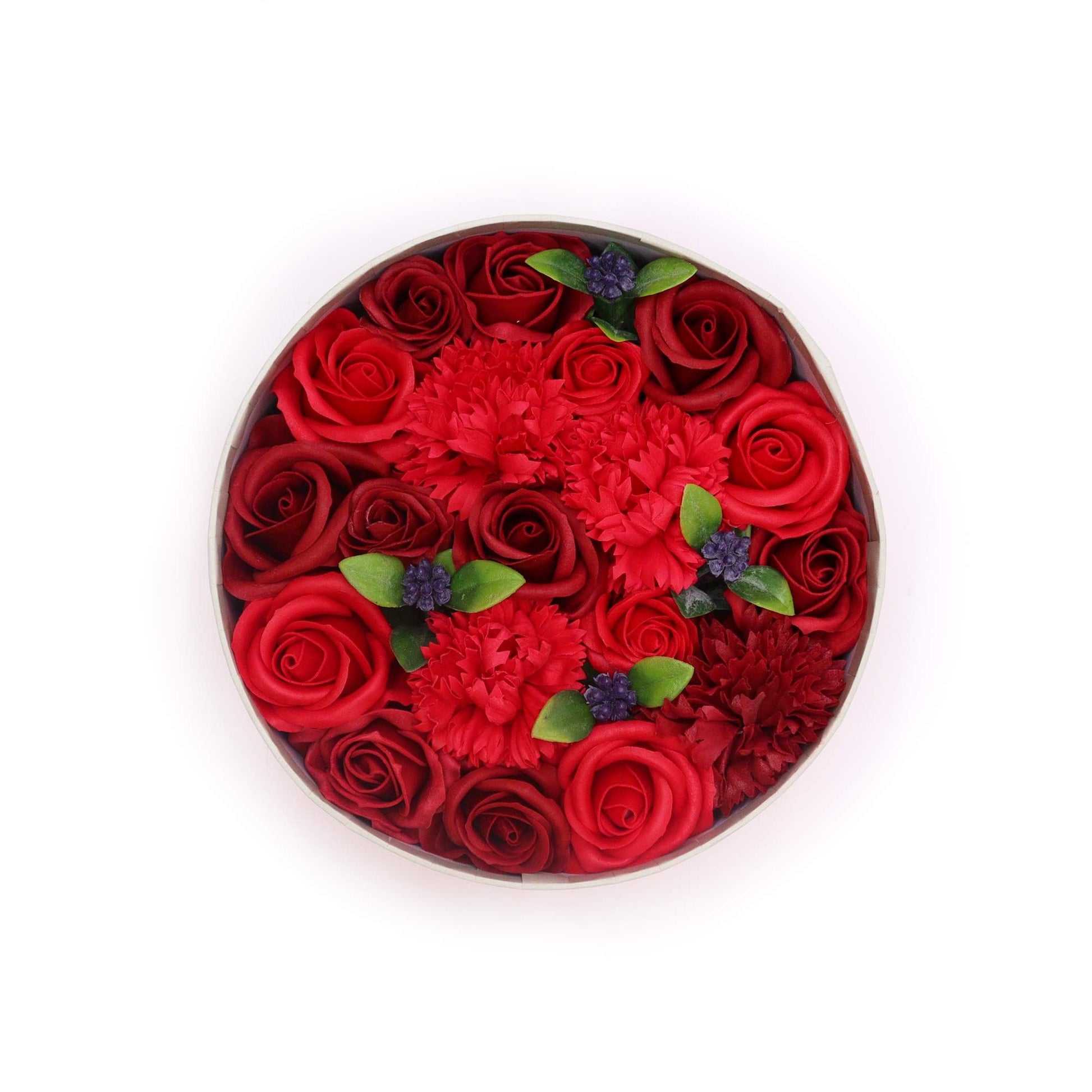 A premium round gift box packed with realistic, deep red soap rose flowers in a classic arrangement.