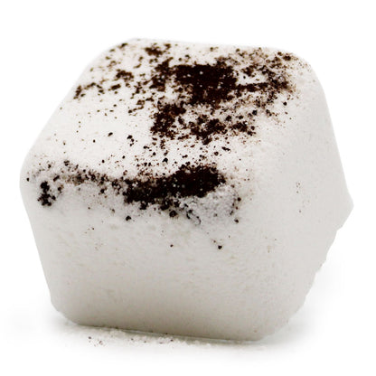 A white square shower steamer tablet topped with dark coffee-like speckles, designed to awaken and refresh the senses.