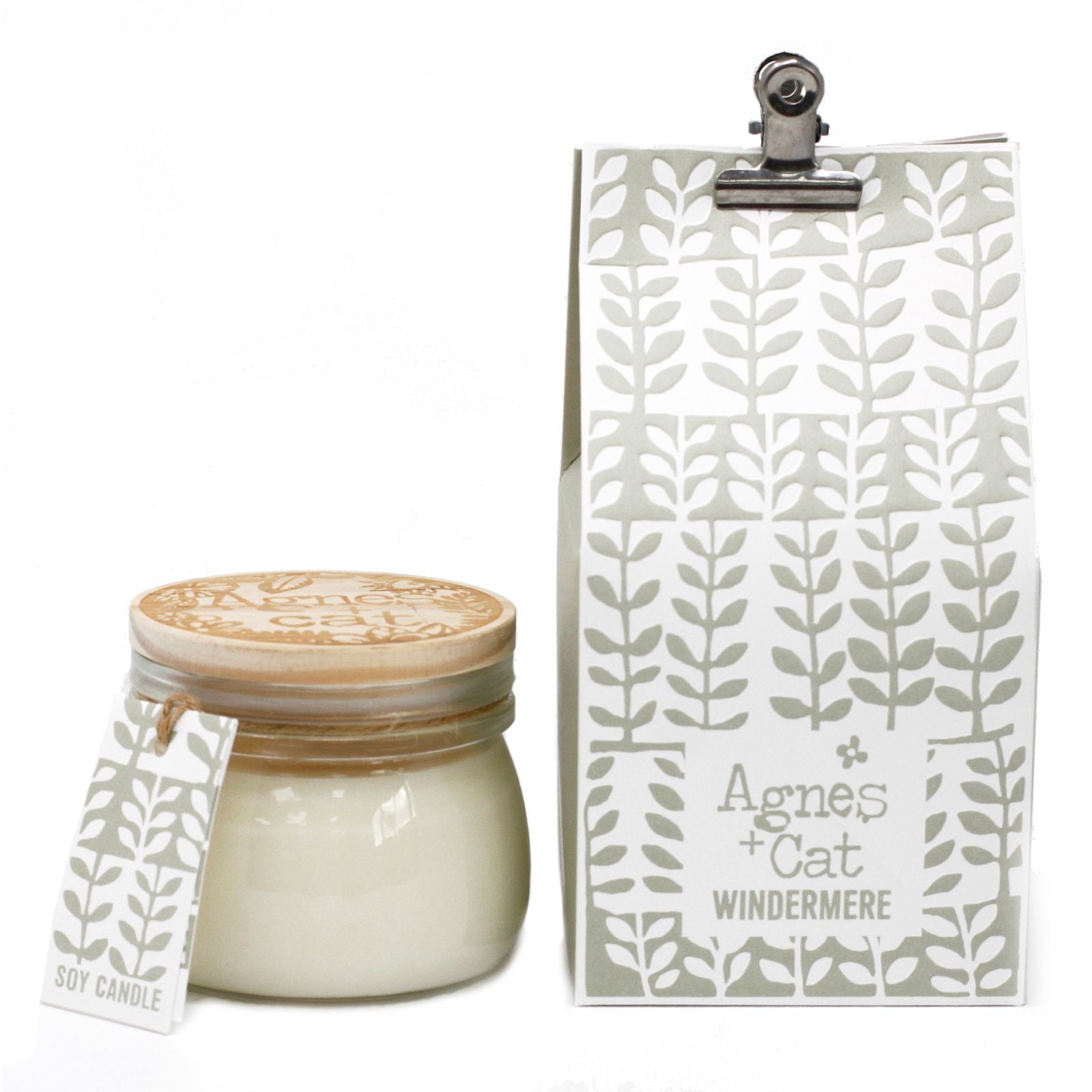 A charming small glass Kilner jar filled with white wax, featuring a silver clip lid and a minimalist botanical label.