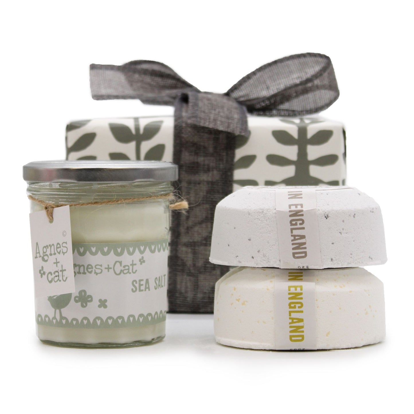 A decorative gift set featuring a Velvet Moon candle and two large bath fizzers in a luxury box with a silver bow.