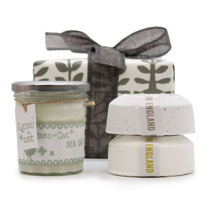 A decorative gift set featuring a Velvet Moon candle and two large bath fizzers in a luxury box with a silver bow.
