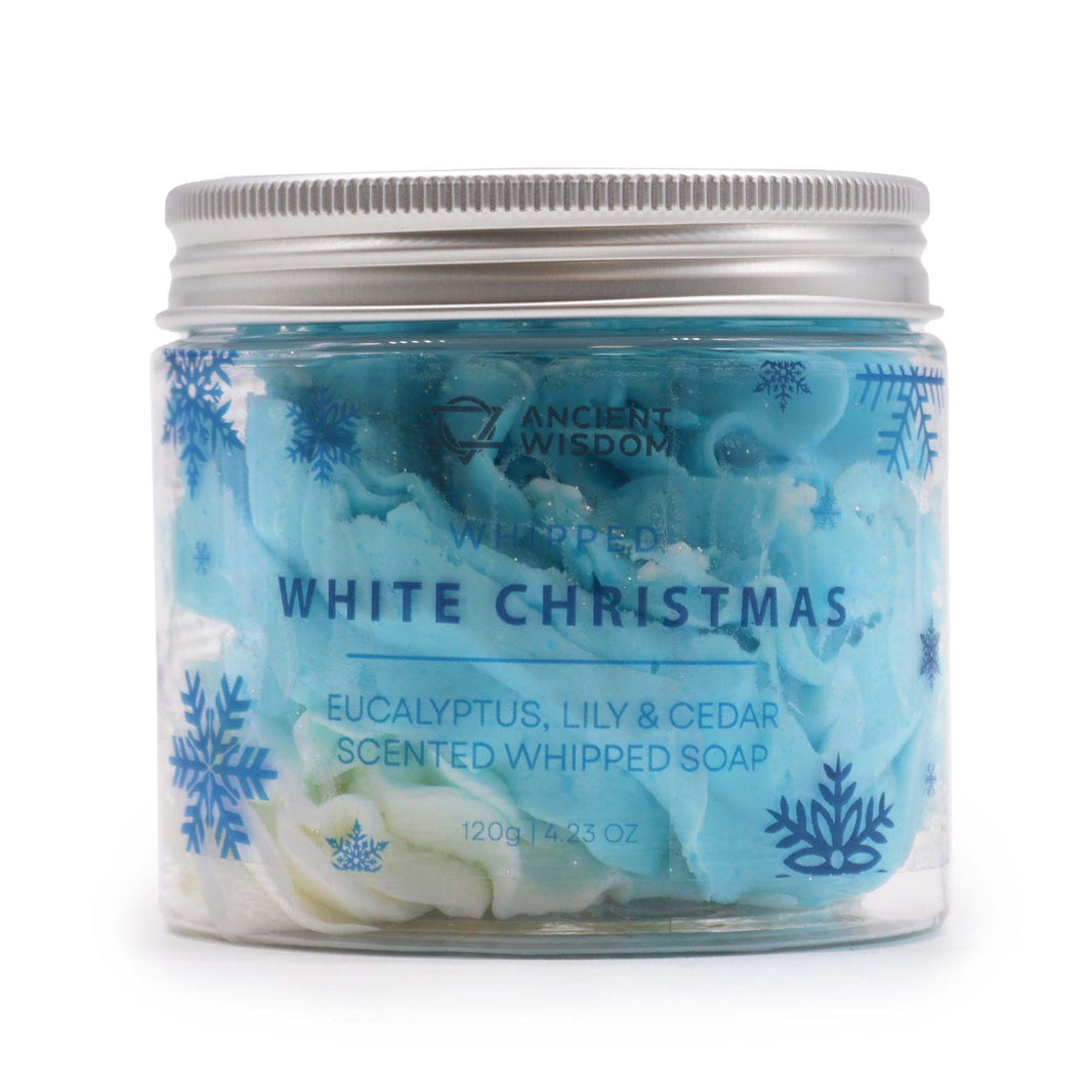 A 120g clear jar of white whipped cream soap with blue accents and a festive holiday-themed label.