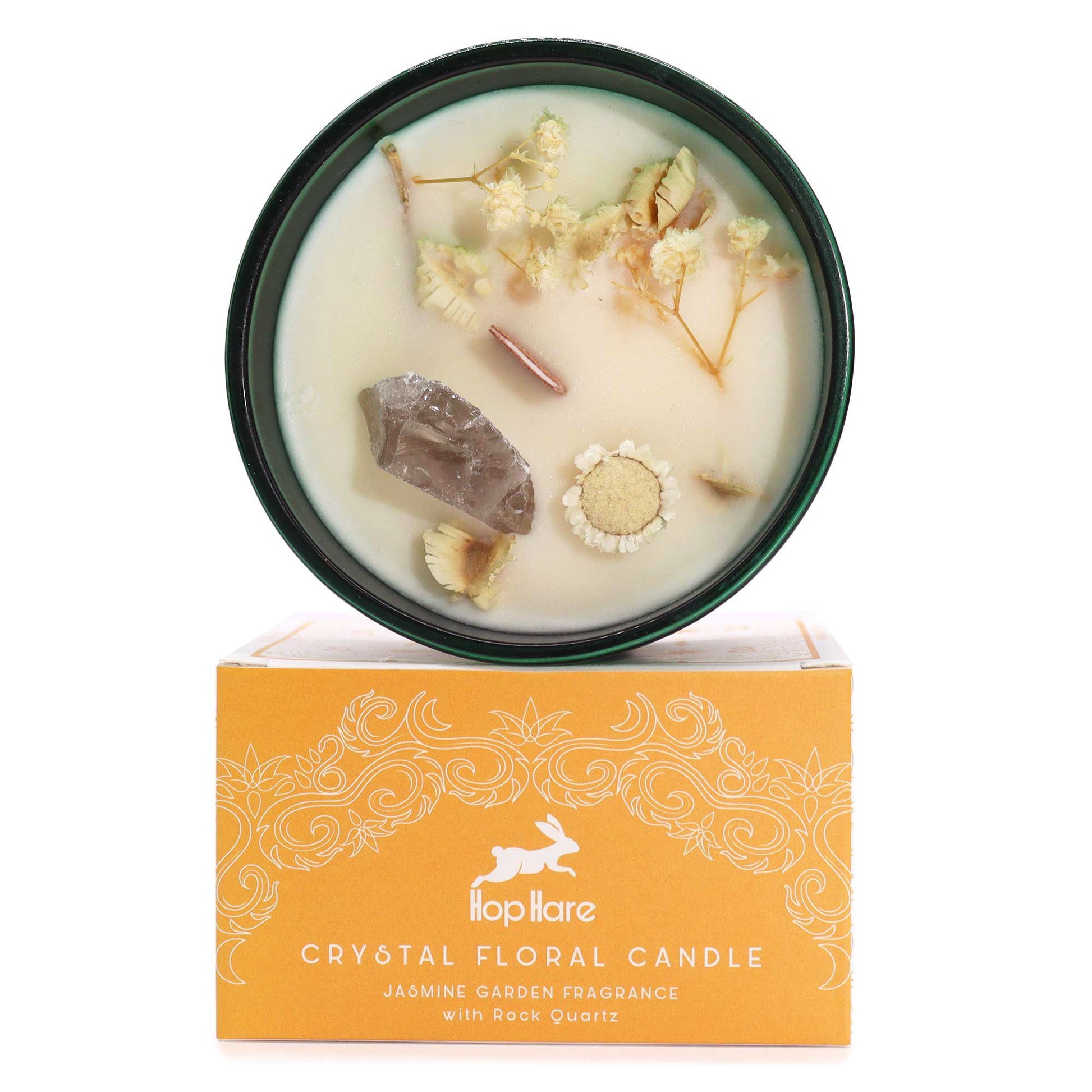 The Lion Hop Hare magic candle with orange-toned wax, embedded healing crystals, and dried flowers for strength.