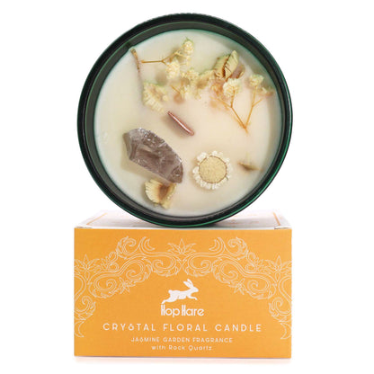The Lion Hop Hare magic candle with orange-toned wax, embedded healing crystals, and dried flowers for strength.