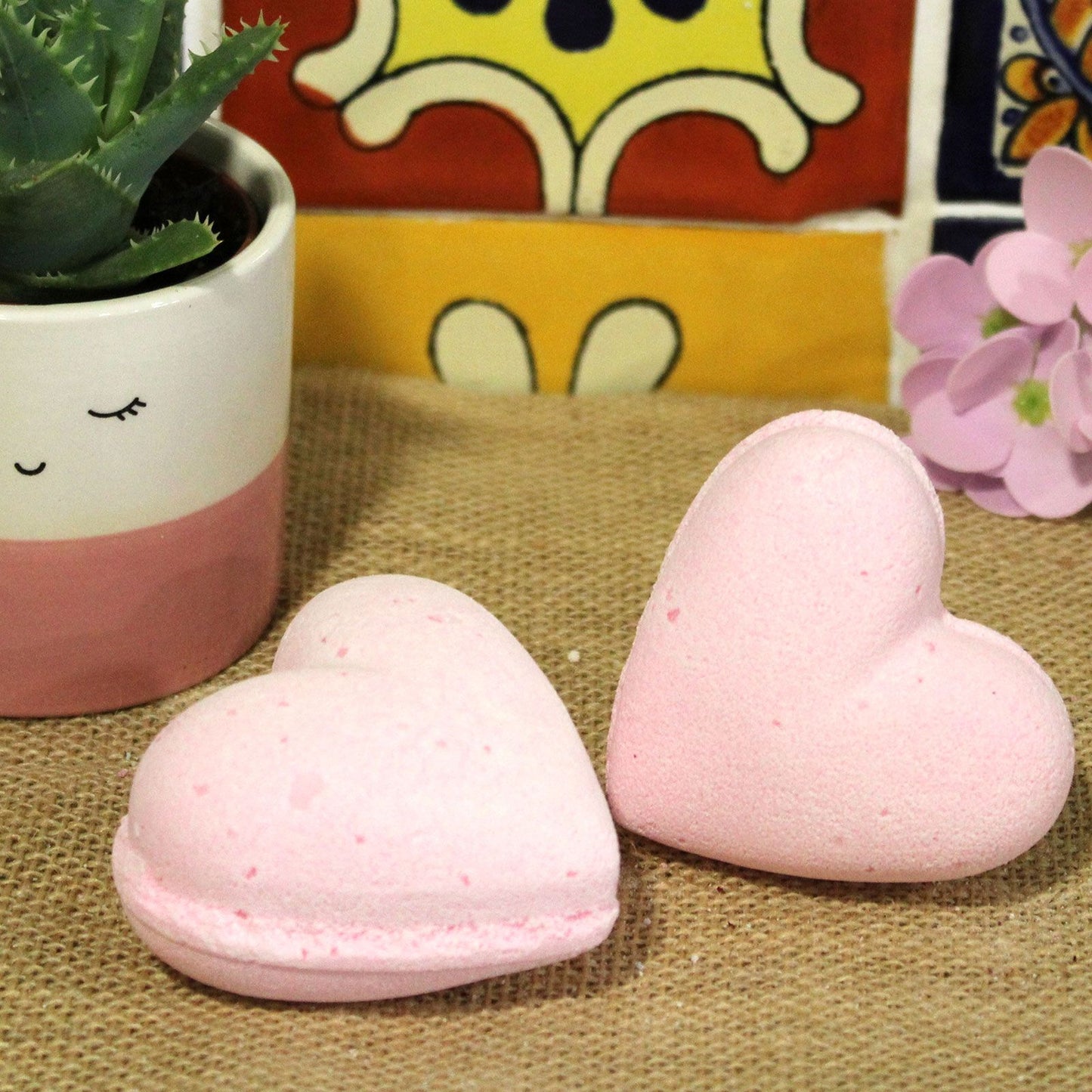 Two pink heart-shaped bath bombs with a sweet bubblegum fragrance, each weighing 70g.