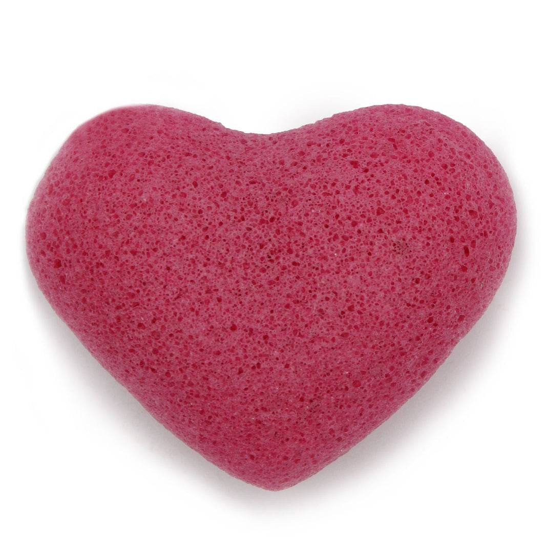 A deep pink, heart-shaped natural Konjac facial sponge designed for gentle skin exfoliation and daily cleansing.