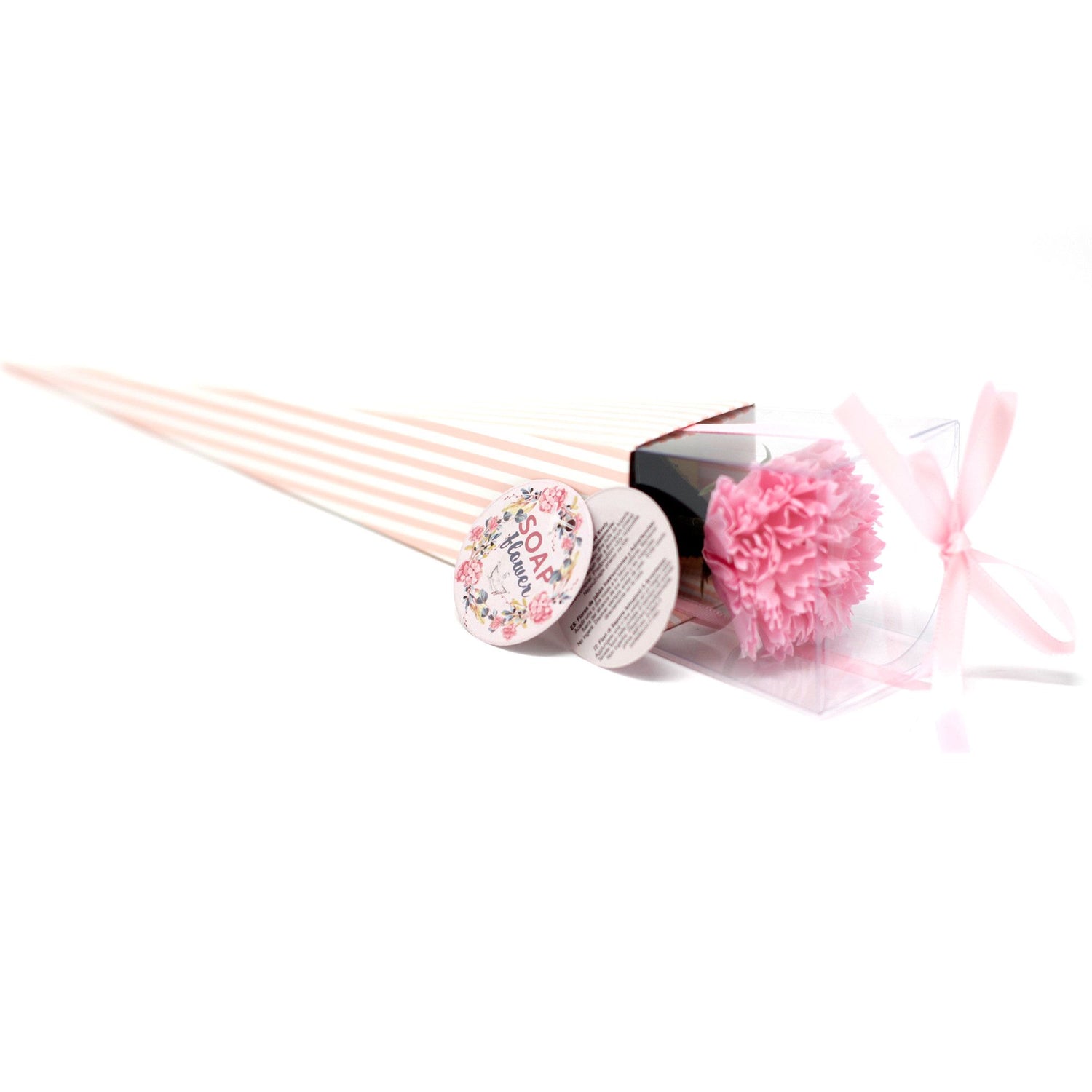A single pink soap flower shaped like a carnation, looking realistic and ready for use in a luxury bath.