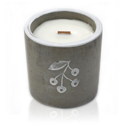 A medium-sized grey concrete vessel featuring a hand-poured soy candle with a clean, modern label.