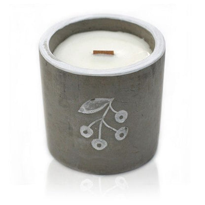 A medium-sized grey concrete vessel featuring a hand-poured soy candle with a clean, modern label.