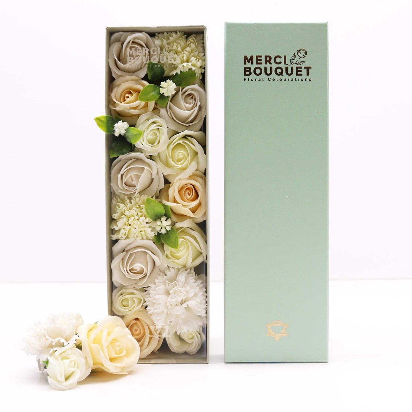 A white long gift box containing a stunning arrangement of realistic white and ivory soap roses for weddings.