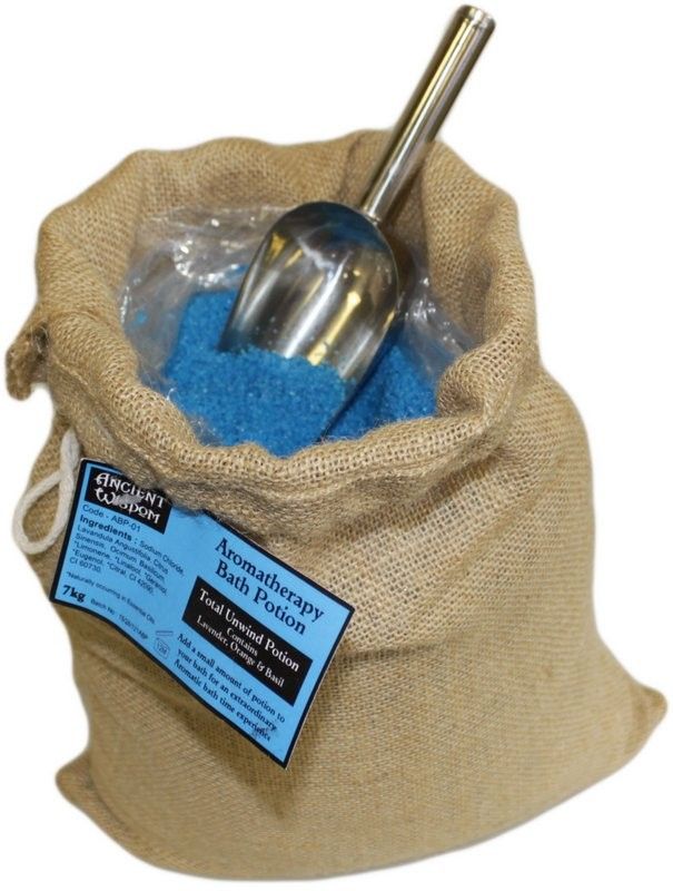 A large 7kg rustic hessian sack of Total Unwind Potion bath salts, featuring a blue label and a traditional wooden scoop.