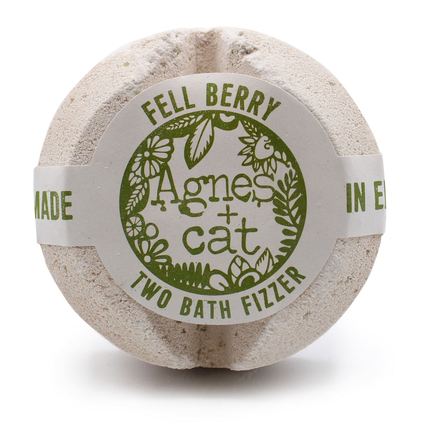 A large spherical bath fizzer with a rustic grey and green label showcasing a unique forest berry design.
