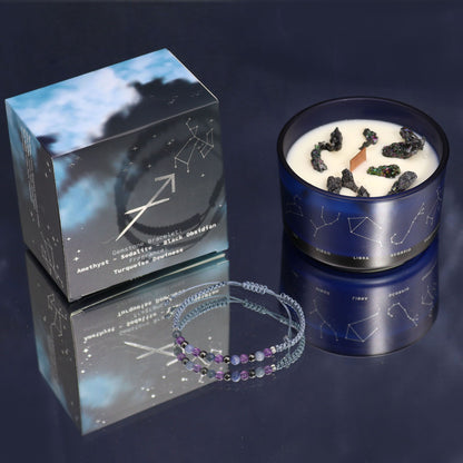 A sophisticated black candle tin with gold Sagittarius foil details and a corresponding gemstone bracelet.