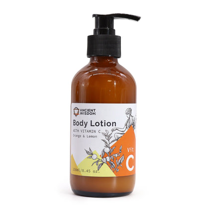 A tall amber pump bottle of orange and lemon scented Vitamin C Goddess body lotion with a luxury white and gold label.