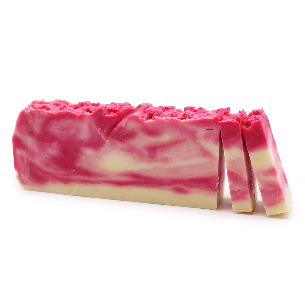 A 110g artisan soap slice with pink and cream marbling, infused with rosehip oil and natural olive oil for skin health.