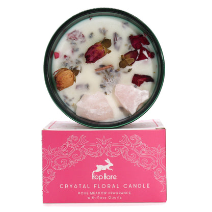 The Lovers crystal candle in a pink glass jar decorated with raw gemstones and dried flower elements for manifestation.