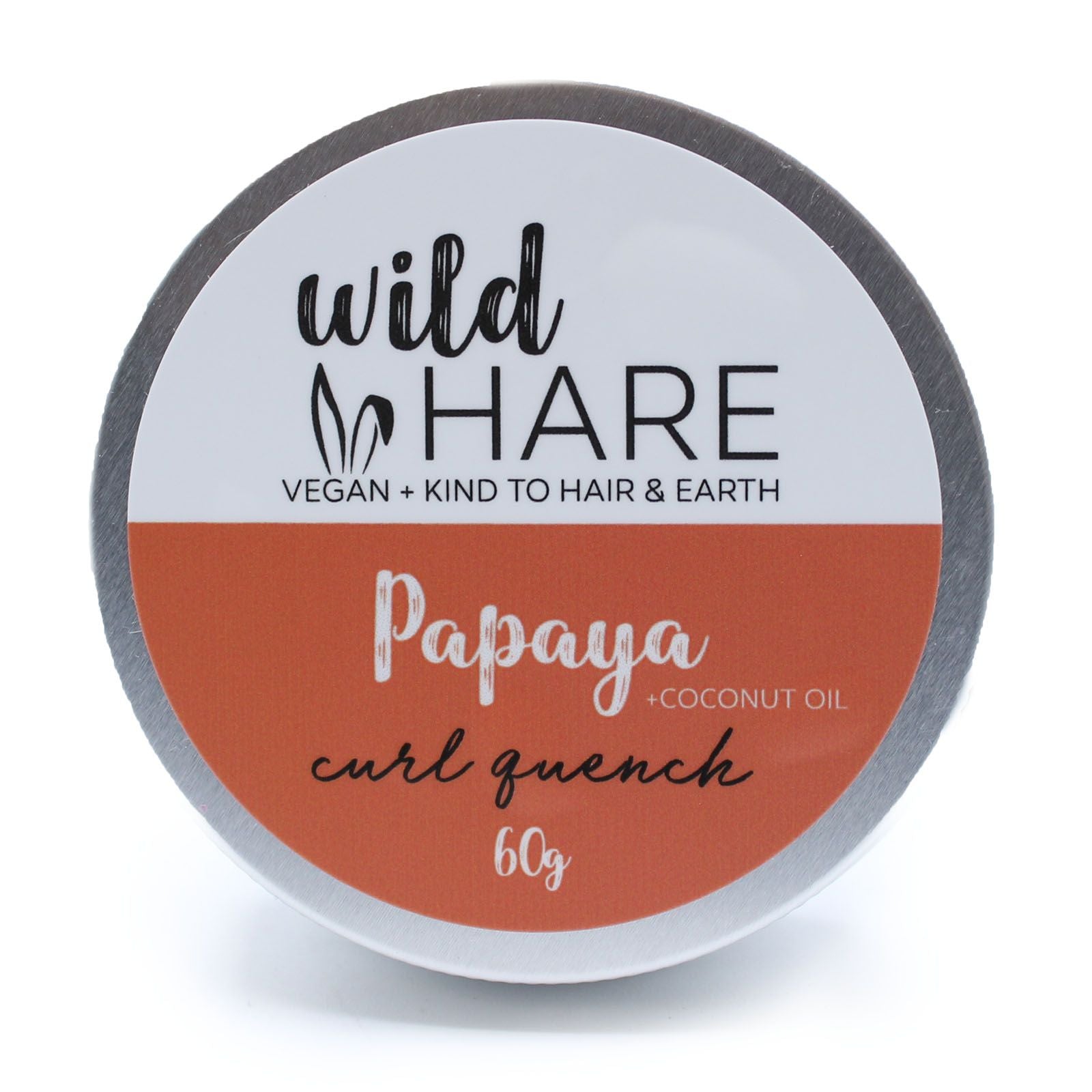 A 60g Wild Hare solid shampoo bar with an orange label, scented with tropical papaya and stored in a travel-ready tin.