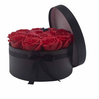 A large round gift box packed with 14 realistic red soap roses, perfect for romantic gestures or anniversaries.